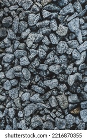 Background Crushed Stone Closeup. Texture Of Granite Gravel From Rubble. Small Stone Building Material. Garden Gravel Stone For Landscaping Design