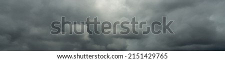 background of dark clouds before a thunderstorm, rainy season clouds, the horror of the atmosphere