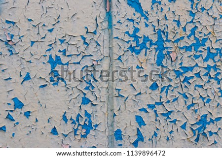 background. defocusing. blue paint cracked on the old wall