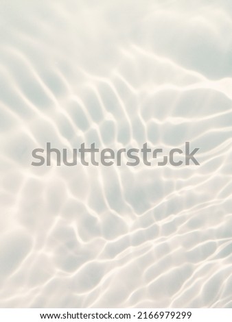 Reflection​ of​ sunlight​ with​ surface​ blue​ water​ for​ background. Abstract​ of​ surface​blue​ water​ for​ background. Blue​ water​ texture​ for​ graphic​ design. Water​ pattern​ for​ background.