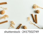 background for design with cinnamon, nuts on a white background.