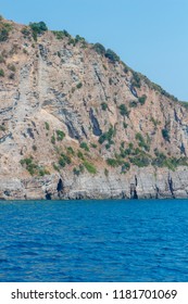 Background for design, texture of steep cliffs and blue sea water