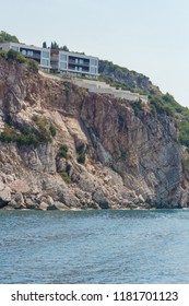 Background for design, texture of steep cliffs and blue sea water