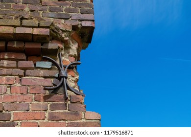Background for design of a wall texture, windows and roof of old houses on a background of blue sky