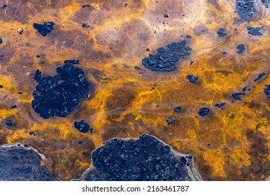 Background Of The Dirty Fuel Oil Water. Fuel Oil Stains With Yellow Water