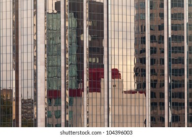Background of distorted reflections of a cityscape in a modern coporate glass-walled building facade