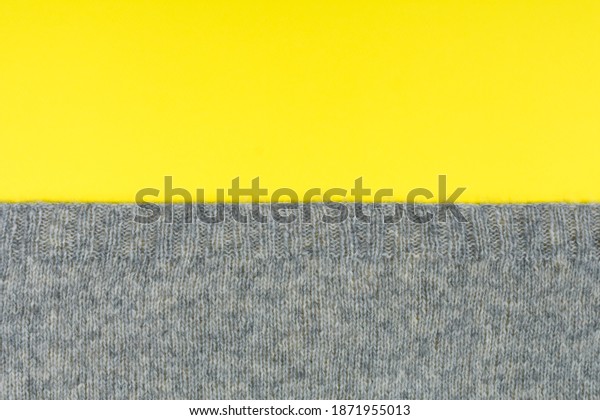 The background is divided into two colors,\
yellow and gray. Demonstration of trendy colors 2021. Place for an\
inscription.