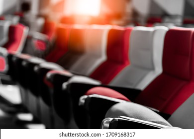 Background of empty cinema auditorium movie film theater with red seats. Professional presentation conference meeting event, classic music opera. Close during coronavirus social distancing quarantine