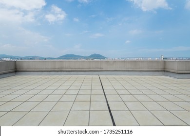 Background of empty platform under blue sky.