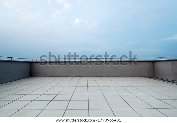Background of empty\
platform under blue\
sky.