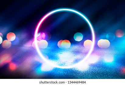 Background of empty stage, room. Reflection on wet pavement, concrete. Neon blurry lights. Neon circle figure in the center, smoke