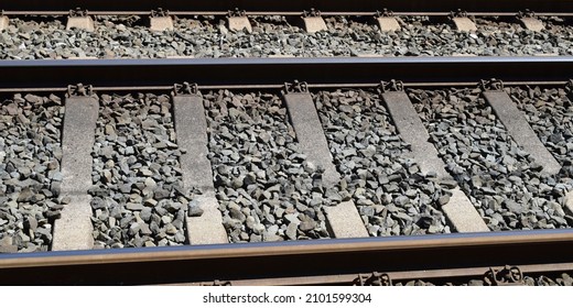 Background Of Empty Train Tracks With Gravel.