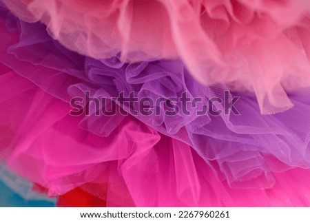 Background fabric texture, material from soft colorful tulle fabric. tulle fabric texture top view. Fashion color trends feminine tutu skirt flat lay, female blog backdrop for text signs design. DOF