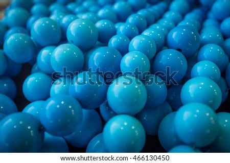 Background of fake blue pearl necklaces for fashion imagery
