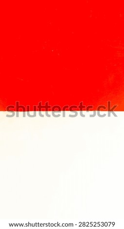 A background featuring a bright red upper section and a pure white lower section, separated by a distinct dividing line. Subtle textures and scratch marks lend a realistic, authentic feel. The red and white colors symbolize Indonesia's spirit, courage, purity, and pride. It is ideal for August-themed content, campaigns, and designs requiring a bold, nationalistic visual.