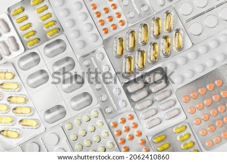 Background fill of many blisters of medical pills, tablets. Treatment concept. Top view of pharmacy drug. Healthcare concept. pharmaceutical background from medicaments. Vitamin