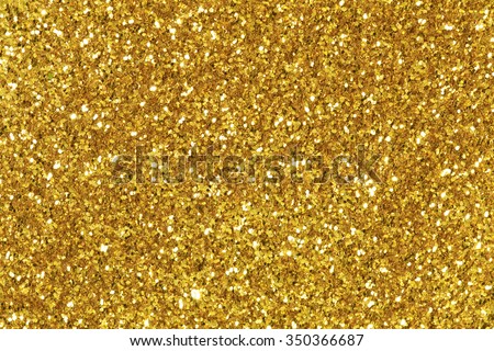 Background filled with shiny gold glitter.