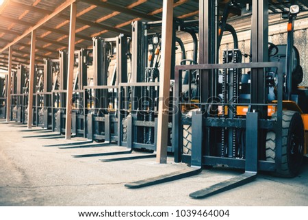 Background of a lot of forklifts, reliable heavy loader, truck. Heavy duty equipment, forklift