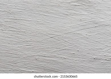 The background is in the form of a fragment of a plastered and whitewashed chalk wall. Texture of whitewashed plaster.