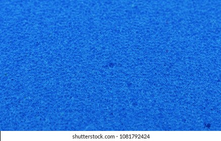 
Background in the form of honeycomb structure of blue color. 
Close-up sponge.