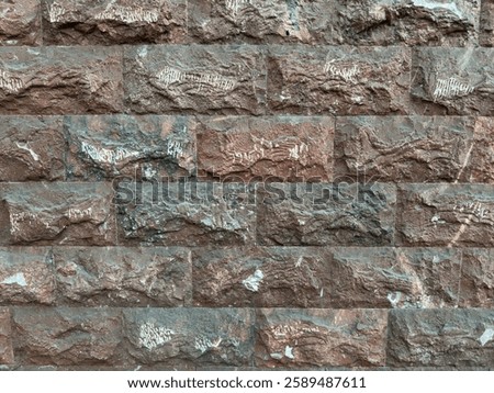 Background in the form of a wall of textured brick and tuff in red, black and gray colors with white tsaramins