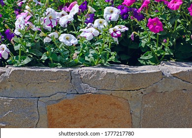 Background. Fragment Of A Stone Garden Bed Close-up.