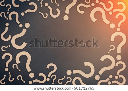 background frame of brown question mark paper cut with free copy space on grey leather background faq concept with light flare effect