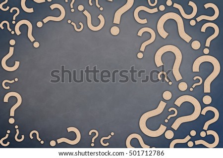 background frame of brown question mark paper cut with free copy space on grey leather background faq concept