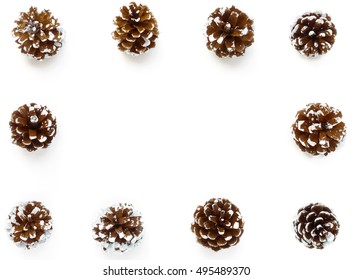 Background Frame out of snowy Pine Cones. Hand painted white for a festive winter look and isolated on white background. 