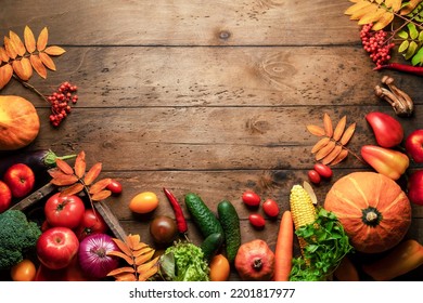 Background Fruits Vegetables Autumn Harvest. Rustic Wooden Background And Frame Made Of Fresh Vegetarian Products For A Healthy Thanksgiving Meal