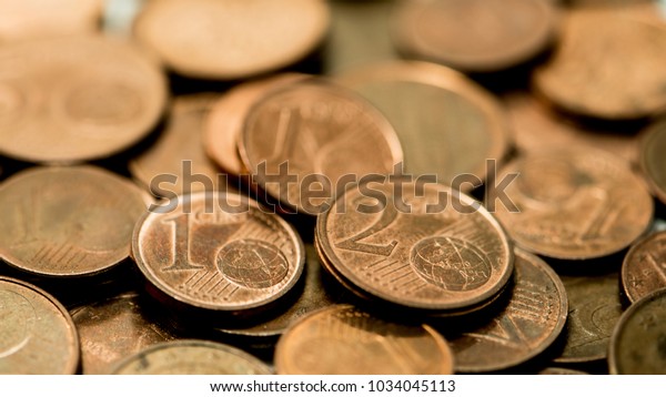 background full of Euro cents, copper coin, one\
and two cents coin will be\
dismissed