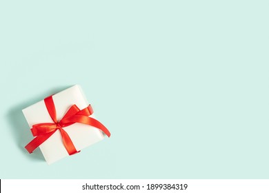 Background with gift with free space for text on pastel blue background. Valentines day concept. Mother's Day concept. Greetings. Copy space. Flat lay, top view. - Powered by Shutterstock