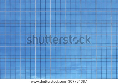 background of glass windows of modern office building