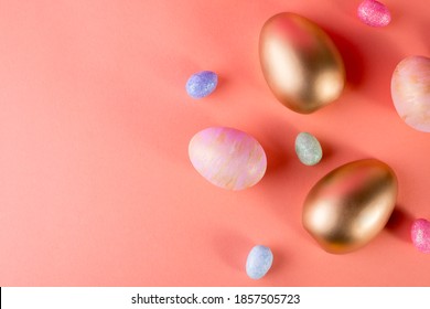 Background and Gold   colored Easter eggs light coral color background and copy space for text  Top view flat lay still life  