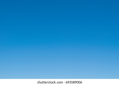 Background of gradient clear blue sky. - Shutterstock ID 693589006
