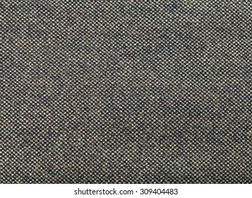 Background From Green And Brown Tweed Fabric Close Up