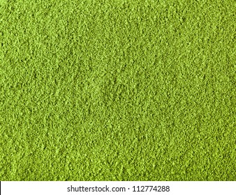 Background of green powder surface close up macro shot 