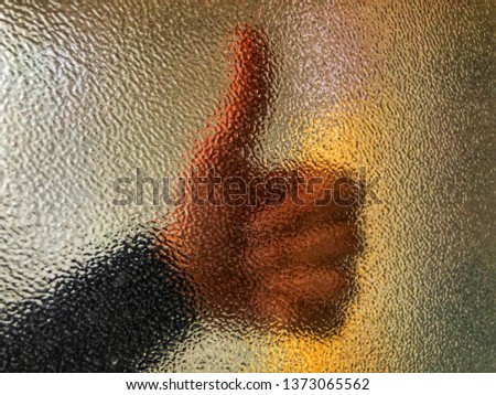 Background grungy glass with hand behind, bathroom, opaque color or beautiful translucent 