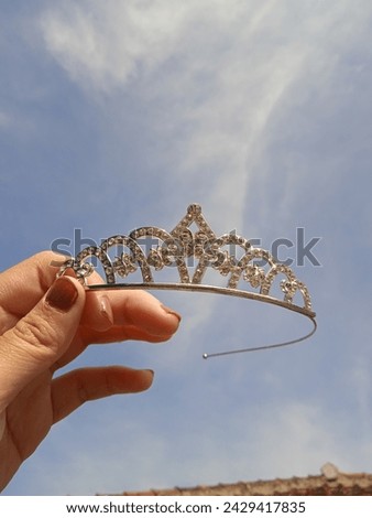 The background has a bright sky and crown theme, really beautiful to use as a background
