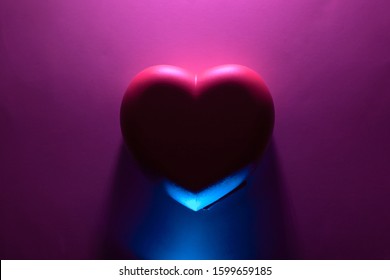 Background with heart of purple and blue neon lights. Backdrop for your design. trendy color 2020. Valentines day/ love concept - Powered by Shutterstock