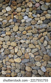 Background Of Home Surrounding Wall Decorated By Pebble Rocks