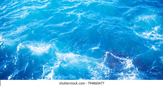 Background Image Of Aqua Sea Water Surface With Sunny Reflections Splitted By Waterline, Aerial View. Ocean Wave Close Up