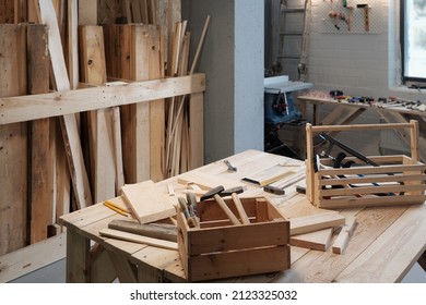 Background image of carpentry workshop with focus on wooden tool boxes in foreground, copy space - Shutterstock ID 2123325032