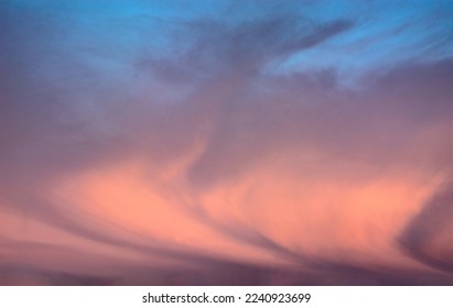 Background image of a colorful and dramatic cloudy sky at the dawn of a polar day in the Arctic. an interesting configuration of clouds. Blank for replacing the sky in photo images