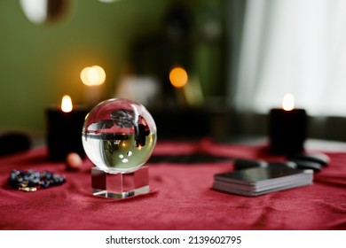 Background Image Of Crystal Ball And Tarot Cards On Red Velvet Table In Fortune Tellers Shop, Copy Space