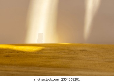 A background image for design or product presentation, with a play of light and shadow. Wooden texture and  beige background