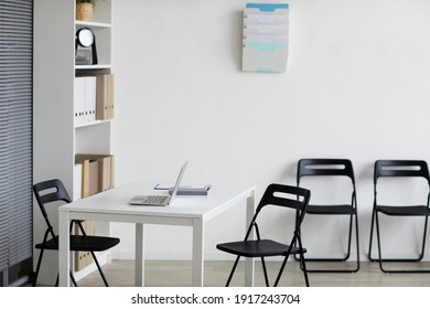 Background Image Of Empty Doctors Office With Desk And Chairs In Row, Copy Space