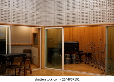 Background Image Of Empty Recording Studio Interior With Musical Instruments In Glass Booth, Copy Space