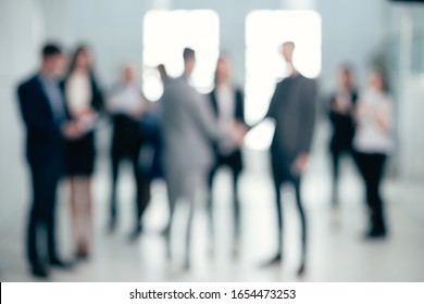 background image of a group of business people in the office lobby
