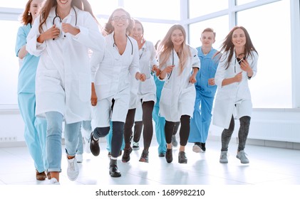 background image of a group of doctors walking together